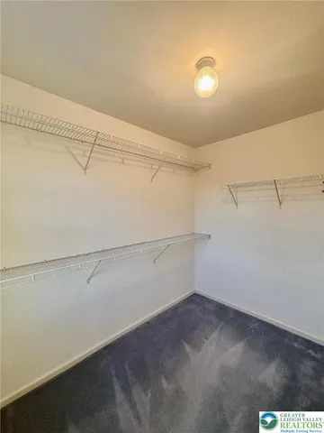 a view of a room with racks on the wall