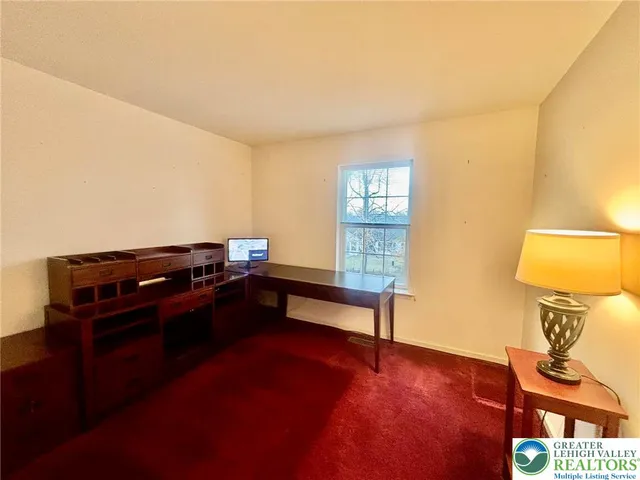 a room with furniture and a window