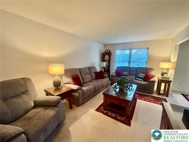 a living room with furniture and a couch