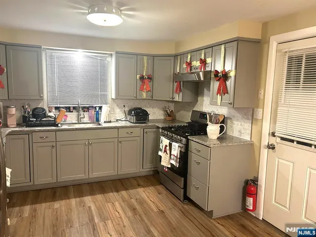 a kitchen with sink cabinets and window