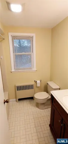 a bathroom with a sink a toilet and bathtub