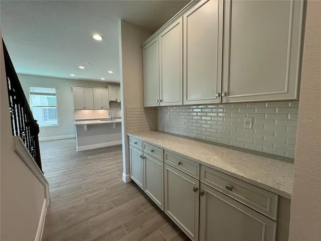 a view of kitchen with wooden floor