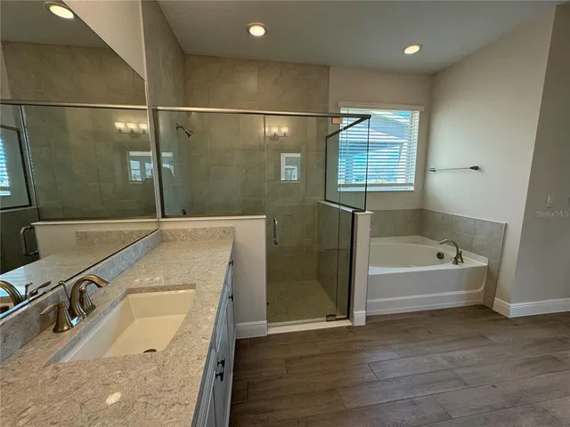 a bathroom with a sink and a bathtub