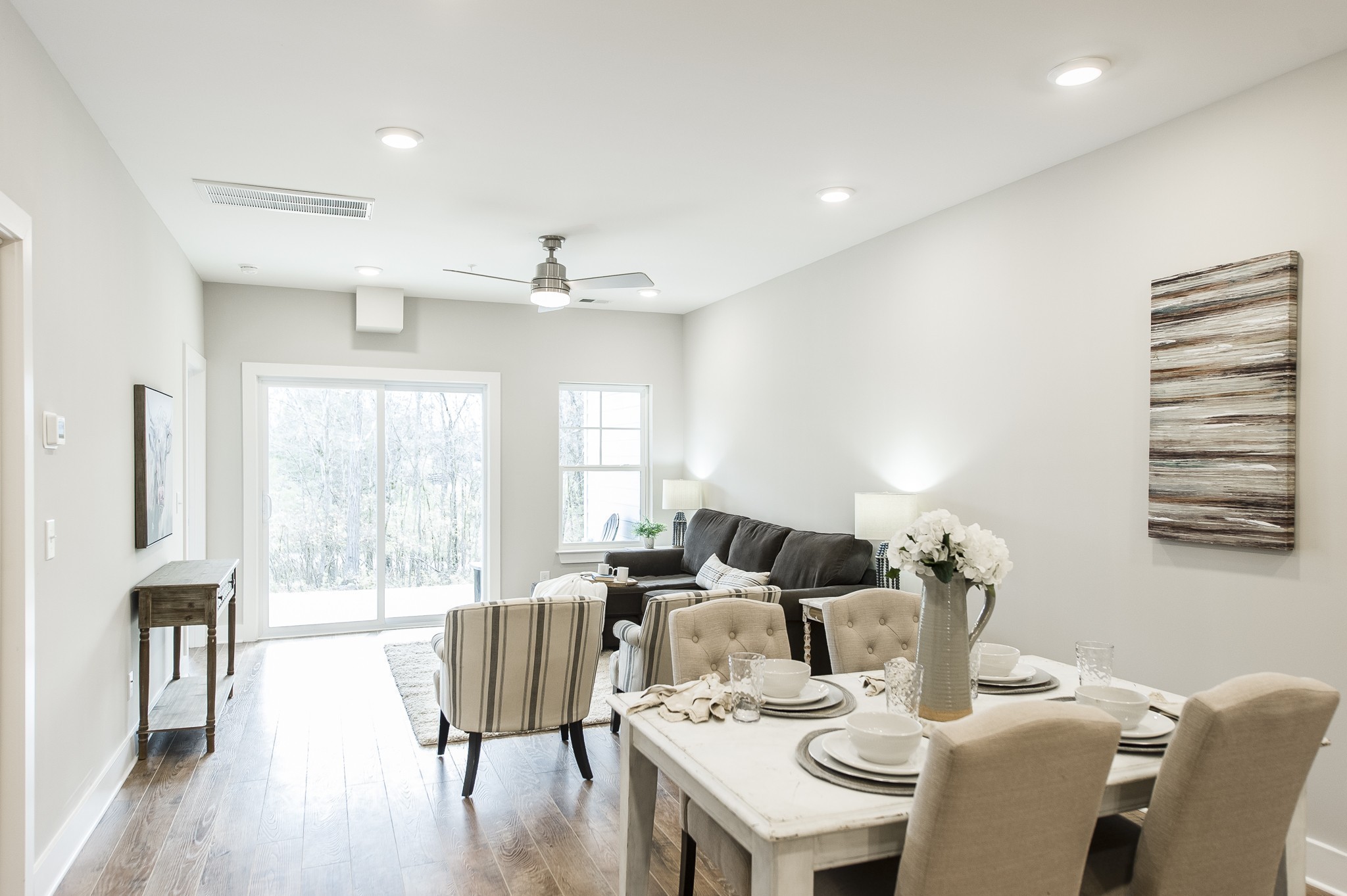 1144 Lock 4 Road, Unit B5 Gallatin, TN 37066 - Photo 11 of 24 The seamless flow between the living, dining, and kitchen areas allows for easy interaction and movement, making it an ideal space for both daily living and entertaining