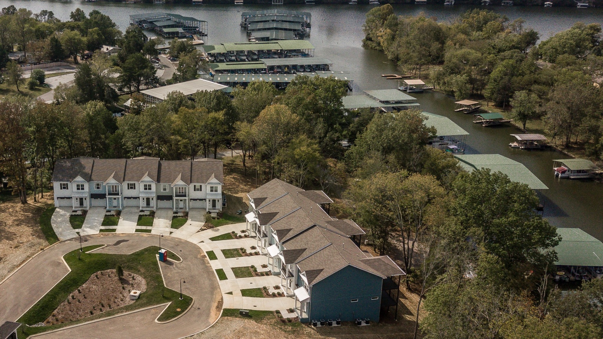 1144 Lock 4 Road, Unit B5 Gallatin, TN 37066 - Photo 3 of 24 With its water and nature-inspired colors, the community exudes a relaxed coastal atmosphere. Residents can enjoy leisurely strolls or golf card rides along the sidewalks and dedicated cart paths that lead to the marina and restaurant