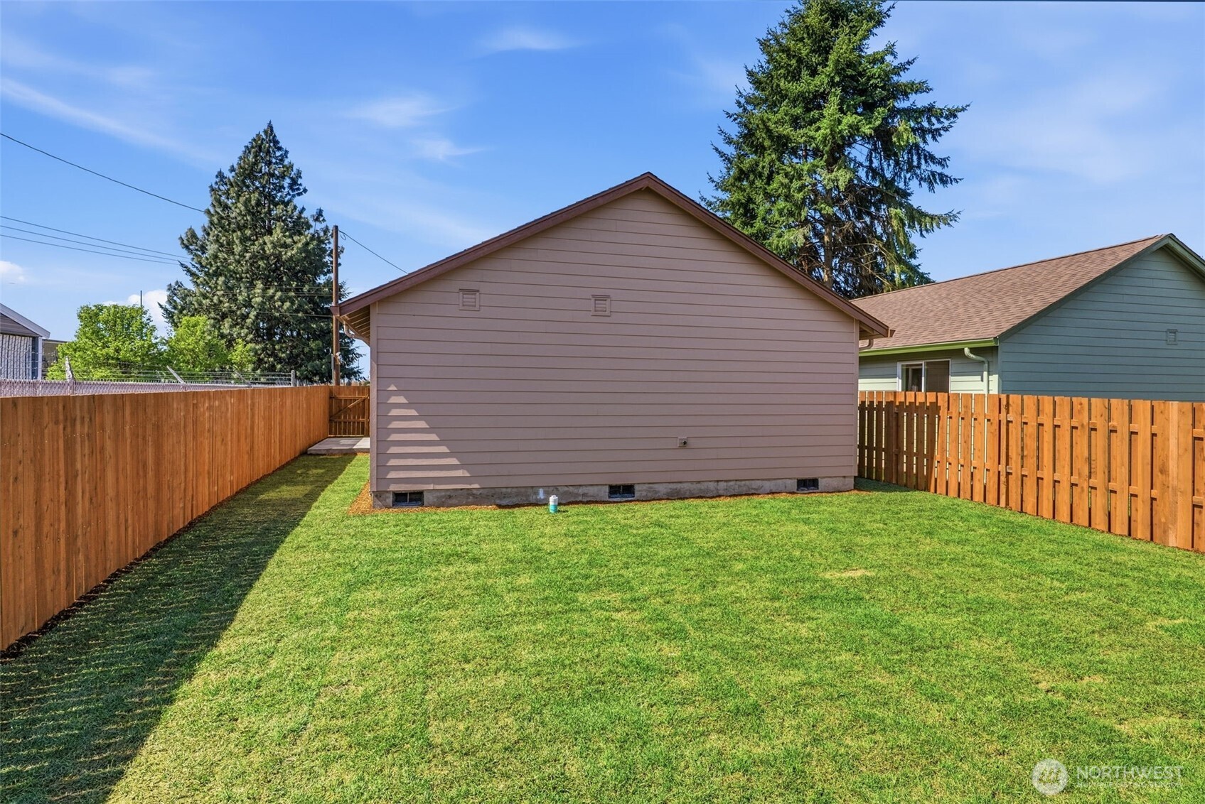 204 Douglas Street Longview, WA 98632 - Photo 13 of 31 a view of a backyard with wooden fence