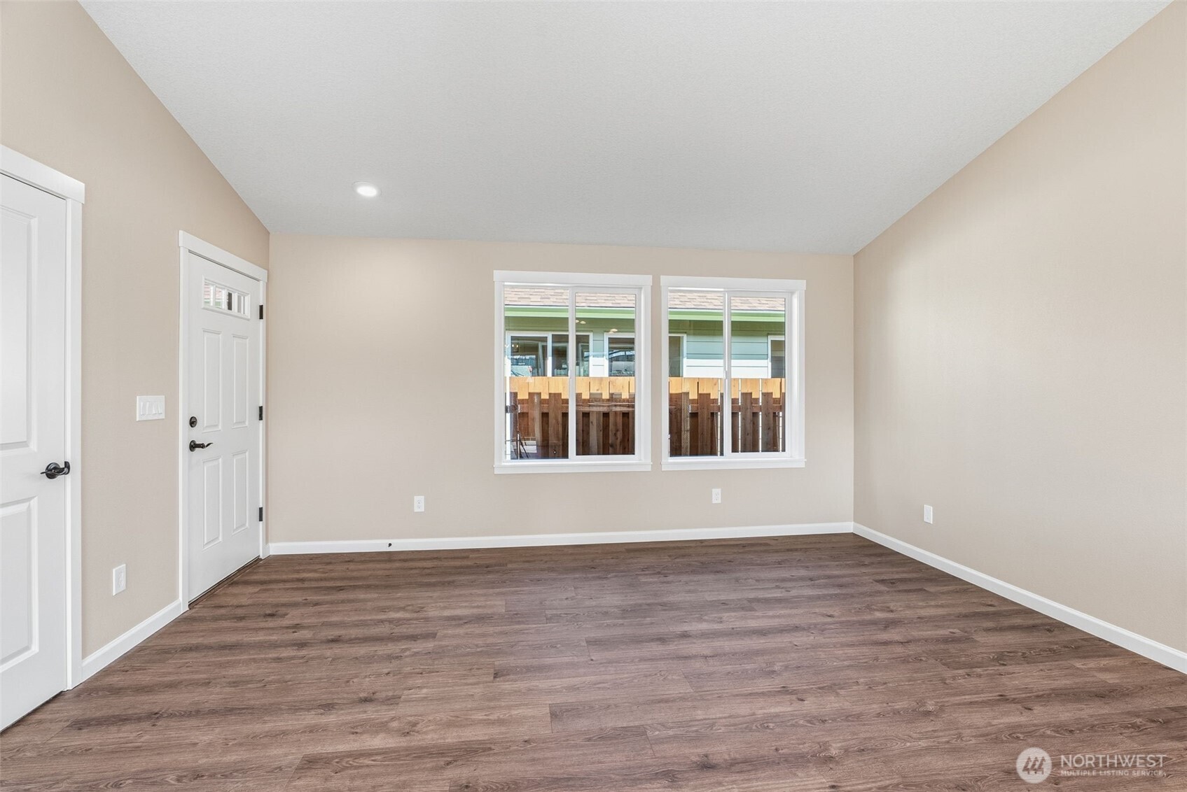 204 Douglas Street Longview, WA 98632 - Photo 15 of 31 a view of an empty room with wooden floor and a window