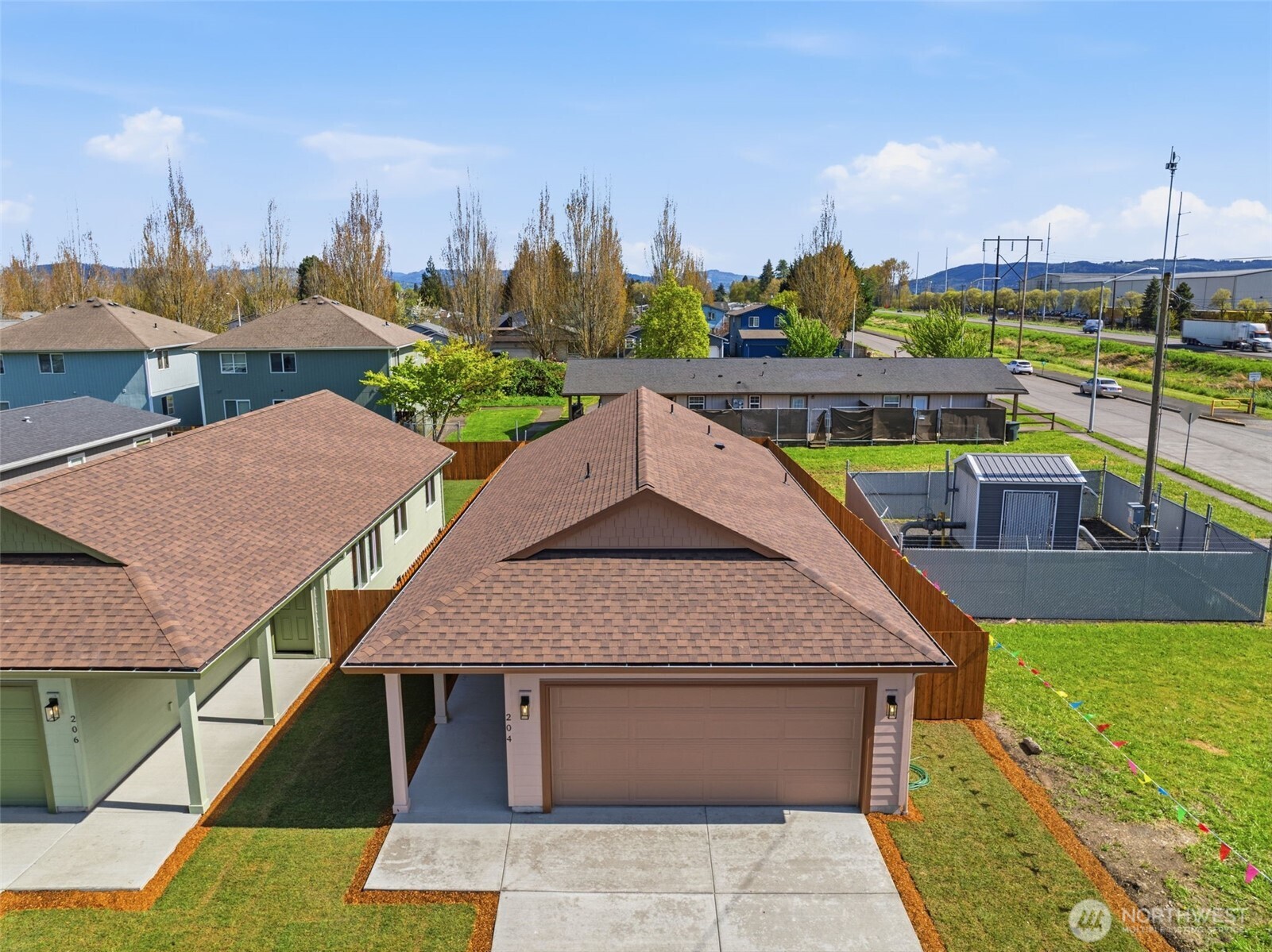 204 Douglas Street Longview, WA 98632 - Photo 2 of 31 a aerial view of a house with swimming pool and a terrace