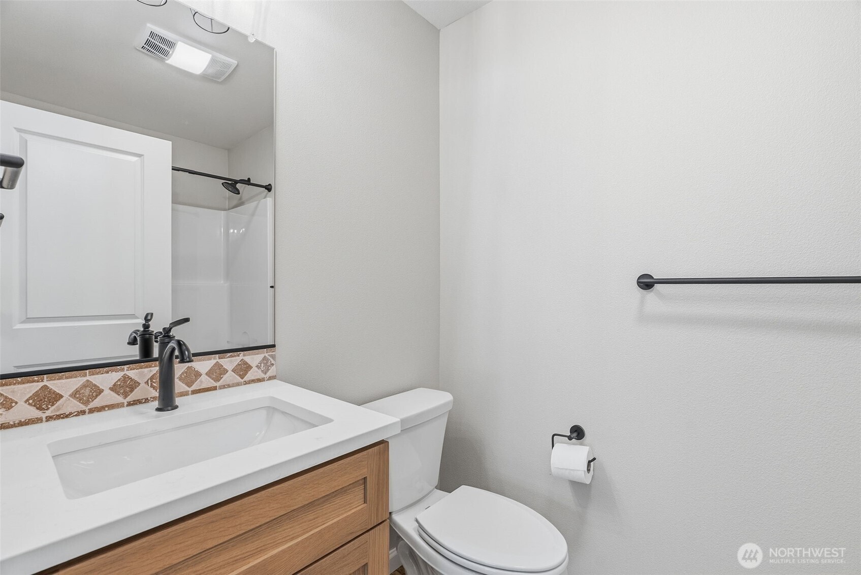 204 Douglas Street Longview, WA 98632 - Photo 24 of 31 a bathroom with a sink and a toilet