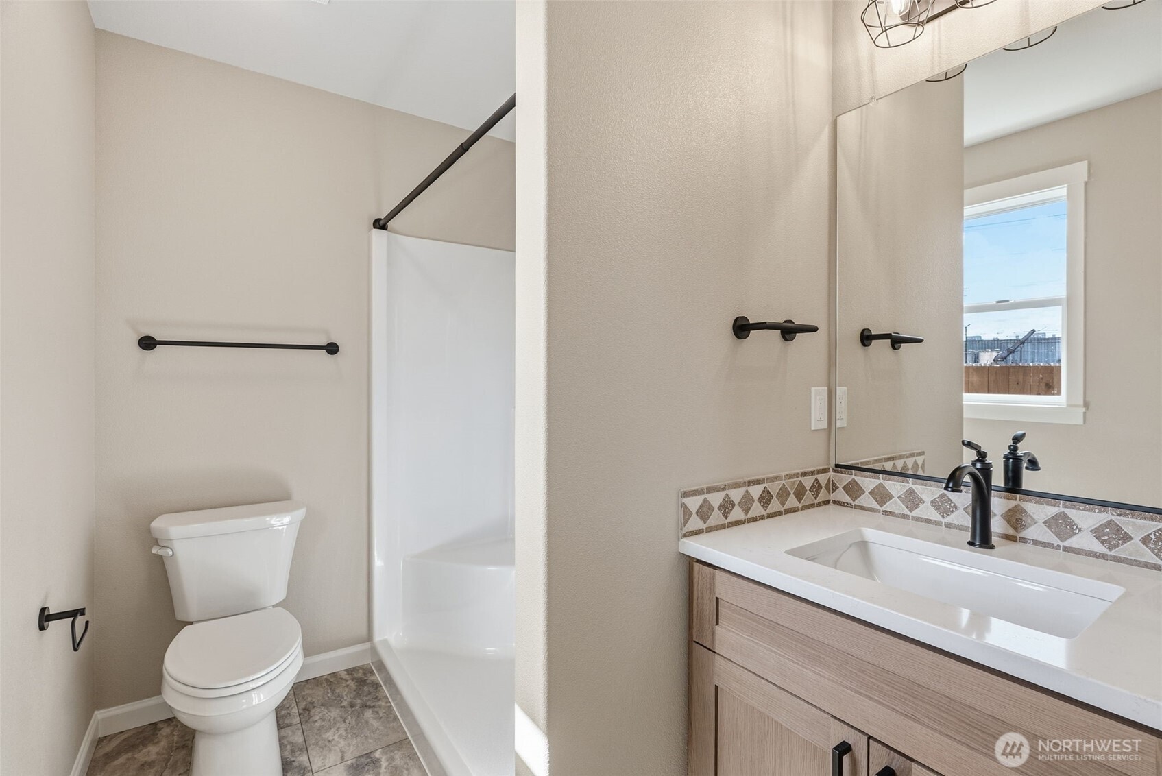 204 Douglas Street Longview, WA 98632 - Photo 30 of 31 a bathroom with a sink and a toilet