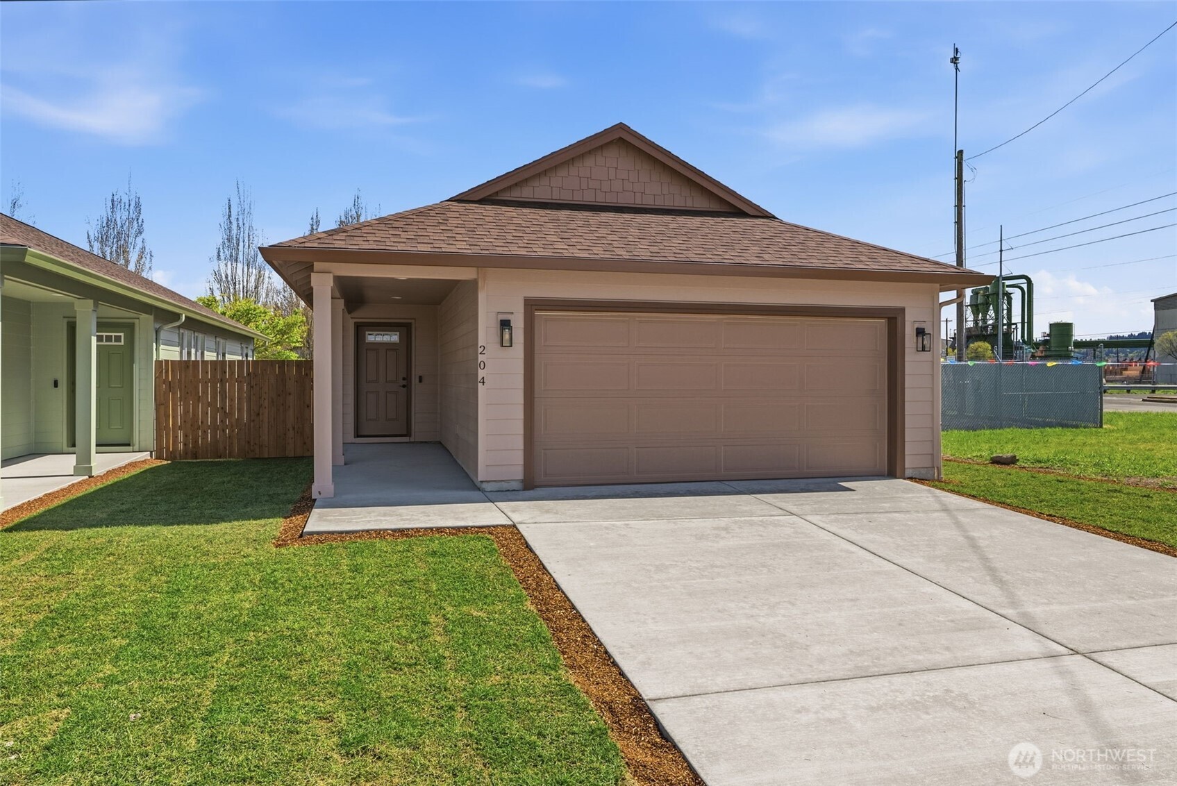 204 Douglas Street Longview, WA 98632 - Photo 8 of 31 a front view of a house with a yard