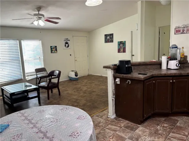 a living room with furniture and a mirror