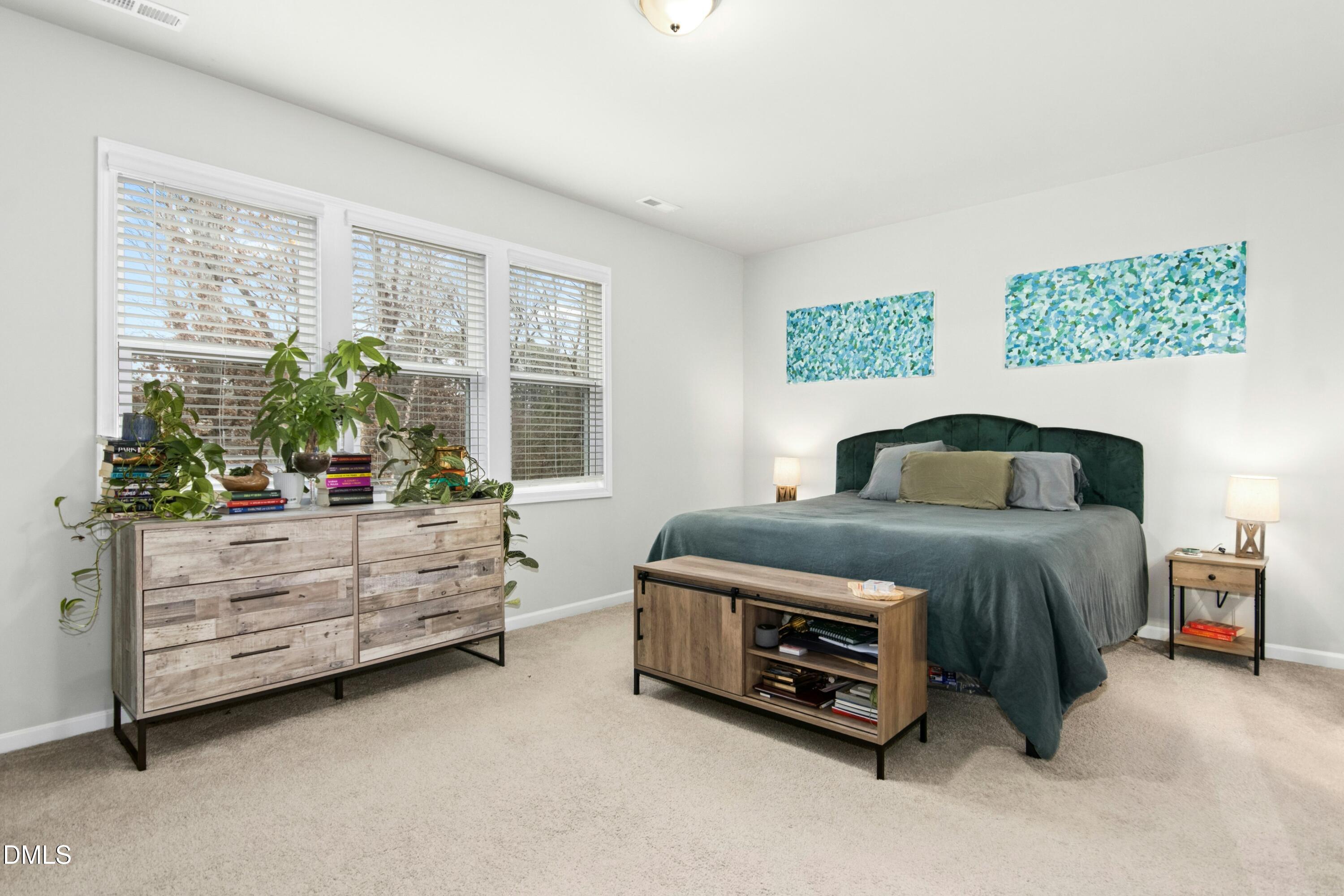 3645 Water Mist Lane Raleigh, NC 27604 - Photo 13 of 29 a bedroom with a bed and a window