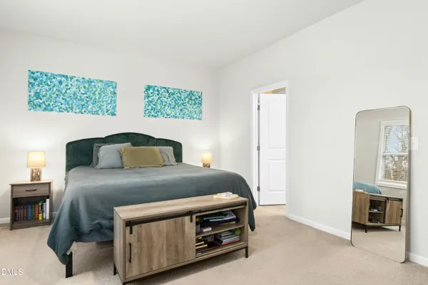 a bedroom with a bed and a cabinets