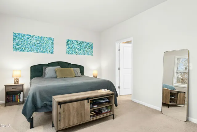 a bedroom with a bed and a cabinets