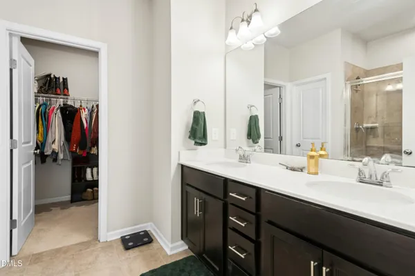 a bathroom with a sink vanity and a mirror