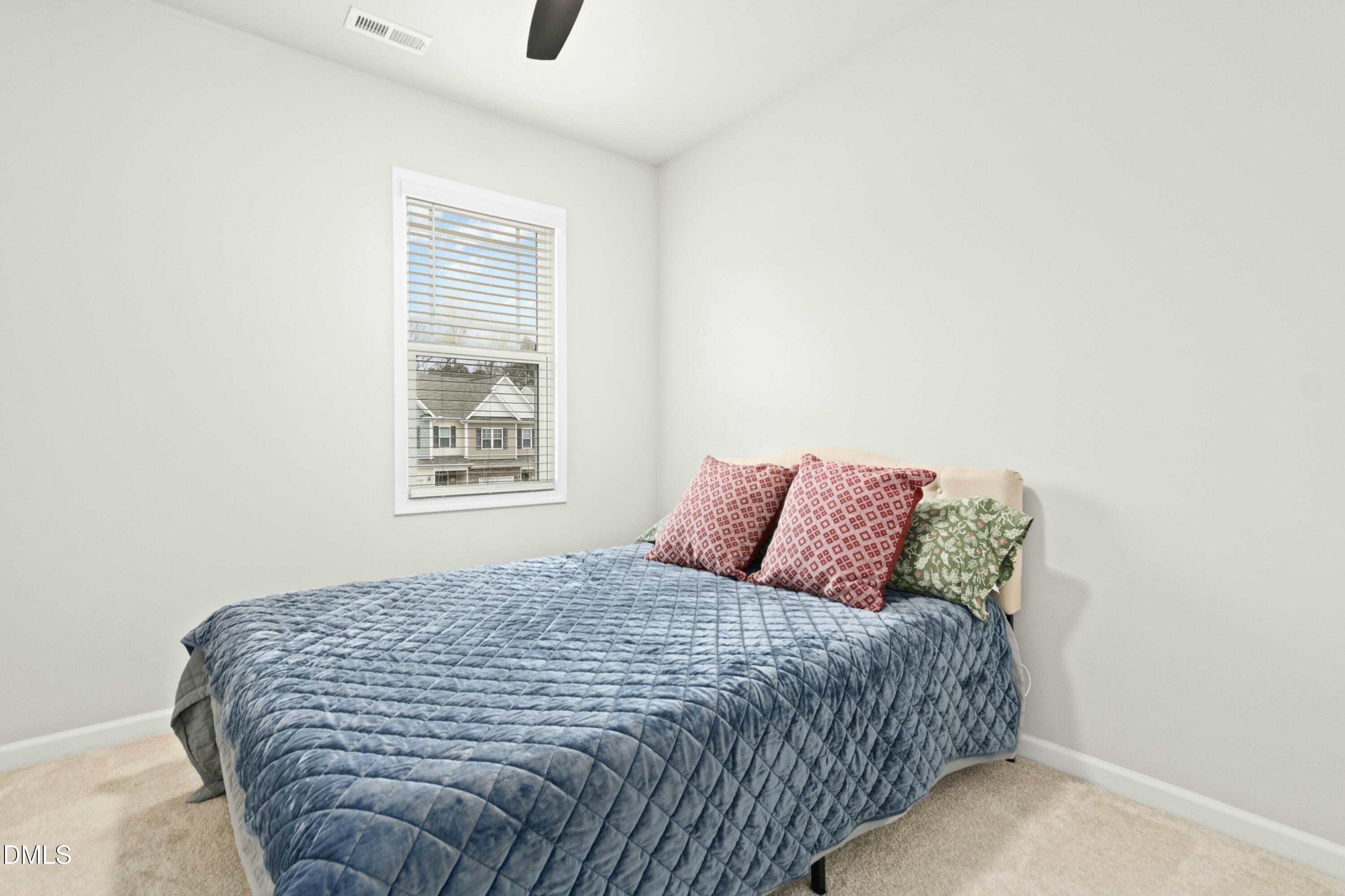 3645 Water Mist Lane Raleigh, NC 27604 - Photo 20 of 29 a large bed sitting in a bedroom next to a window