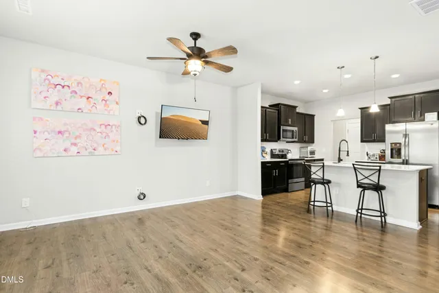 a view of kitchen with cabinets and wooden floor