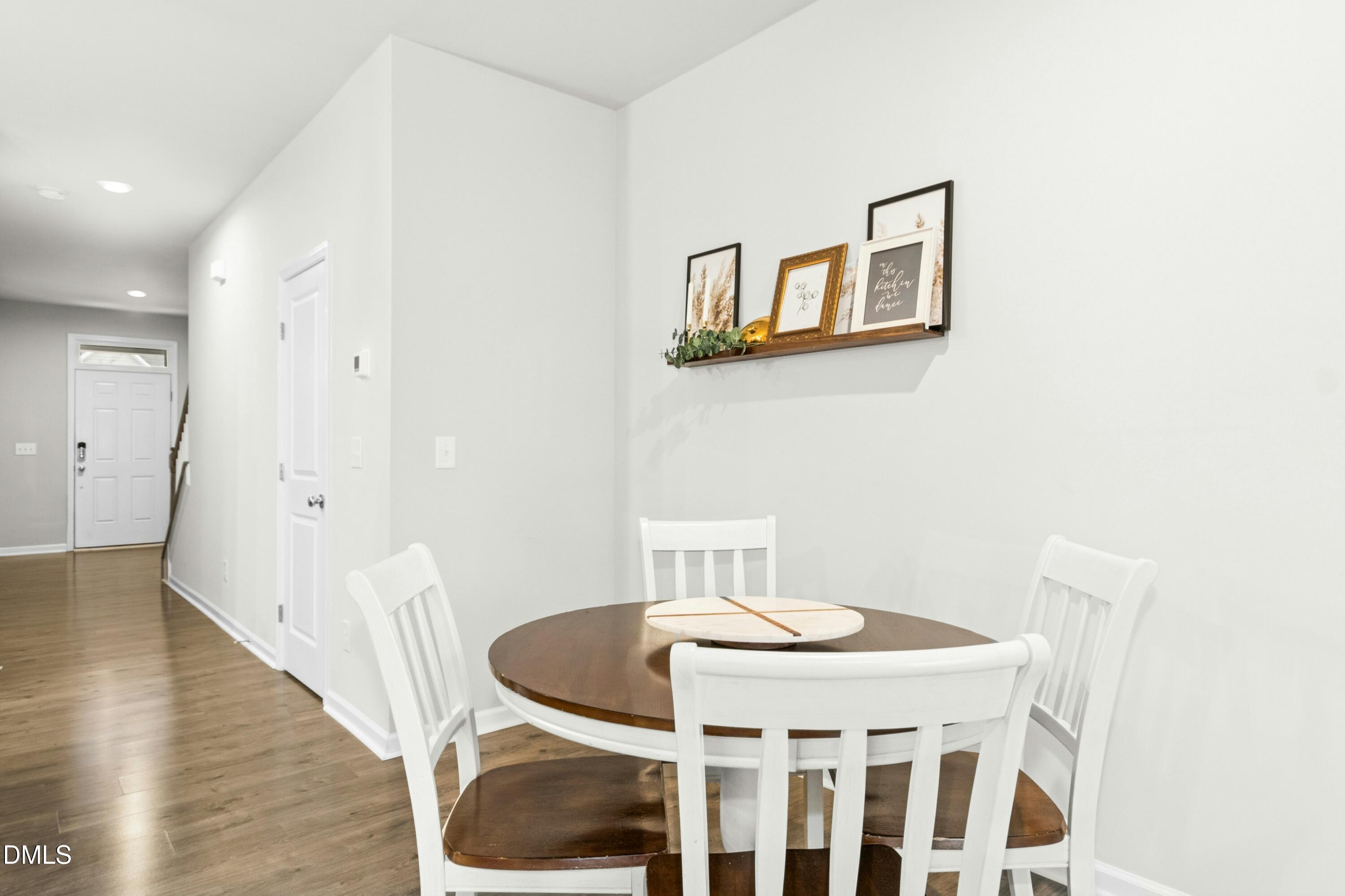 3645 Water Mist Lane Raleigh, NC 27604 - Photo 7 of 29 a dining room with furniture and wooden floor