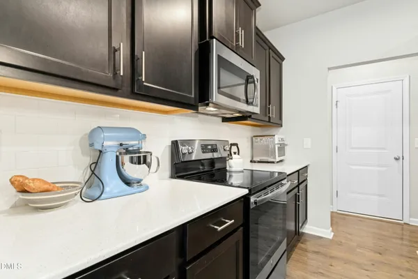 a kitchen with sink and cabinets