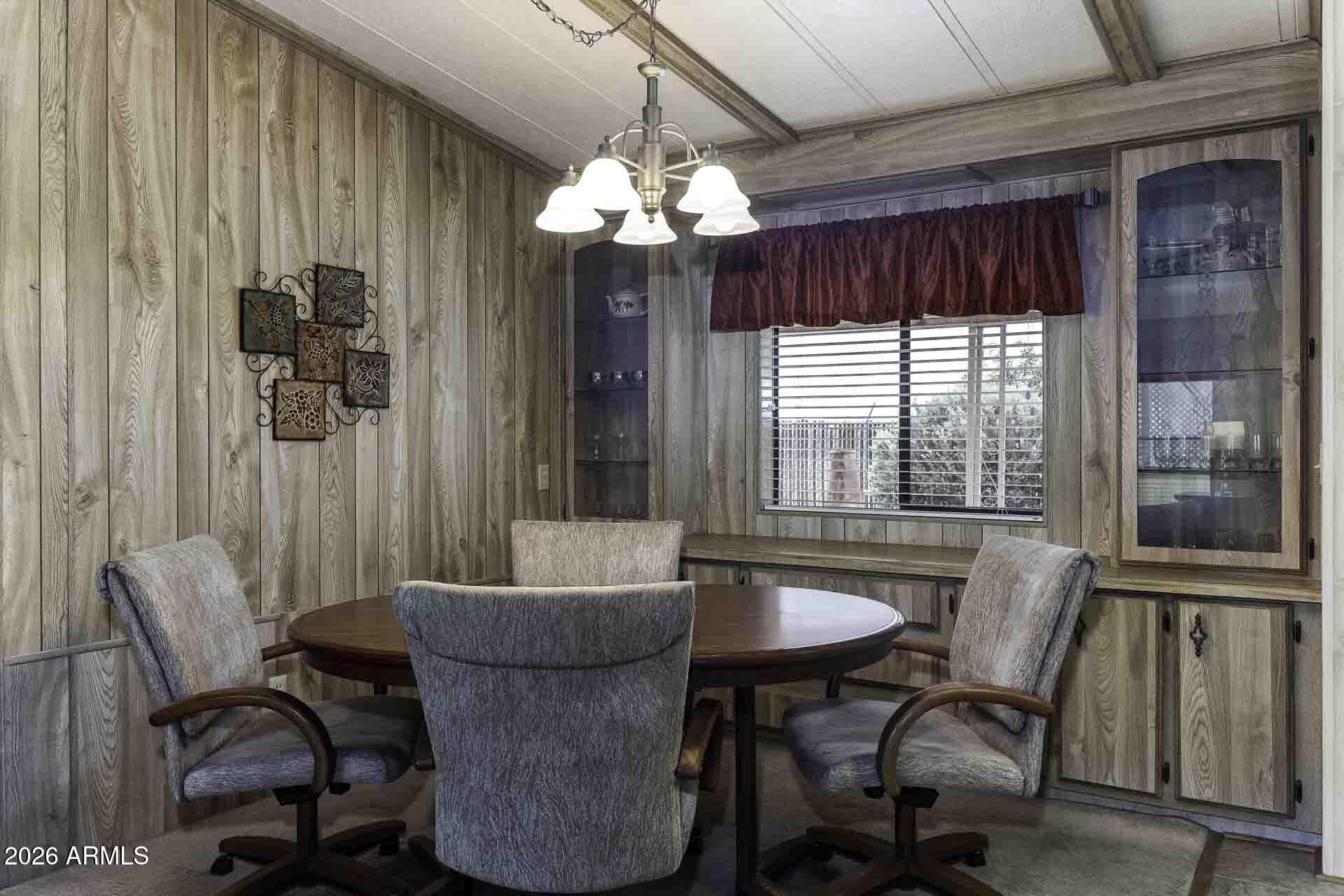 2100 North Trekell Road, Unit 143 Casa Grande, AZ 85122 - Photo 11 of 34 a dining room with furniture and window