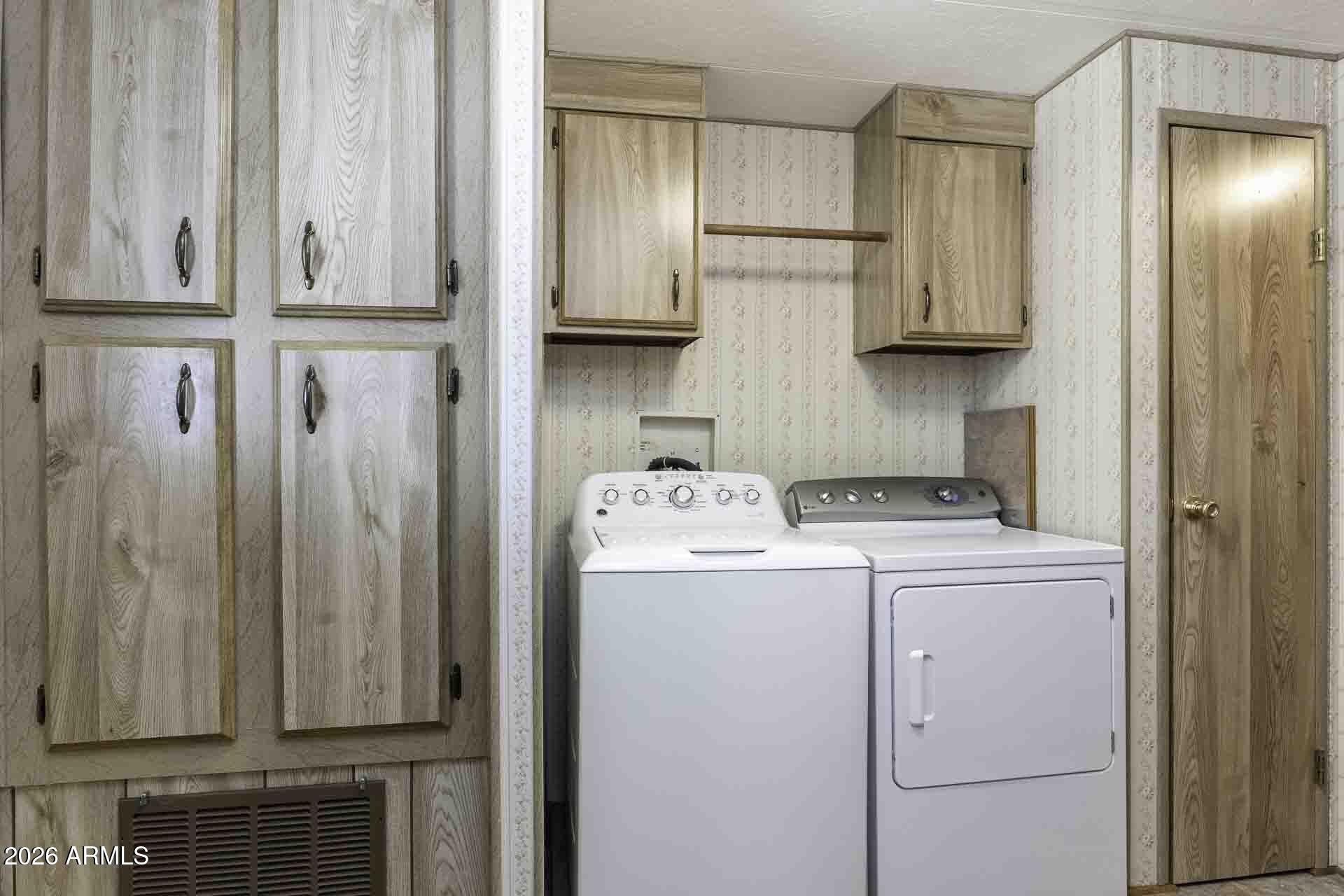 2100 North Trekell Road, Unit 143 Casa Grande, AZ 85122 - Photo 21 of 34 a view of a kitchen with washer and dryer