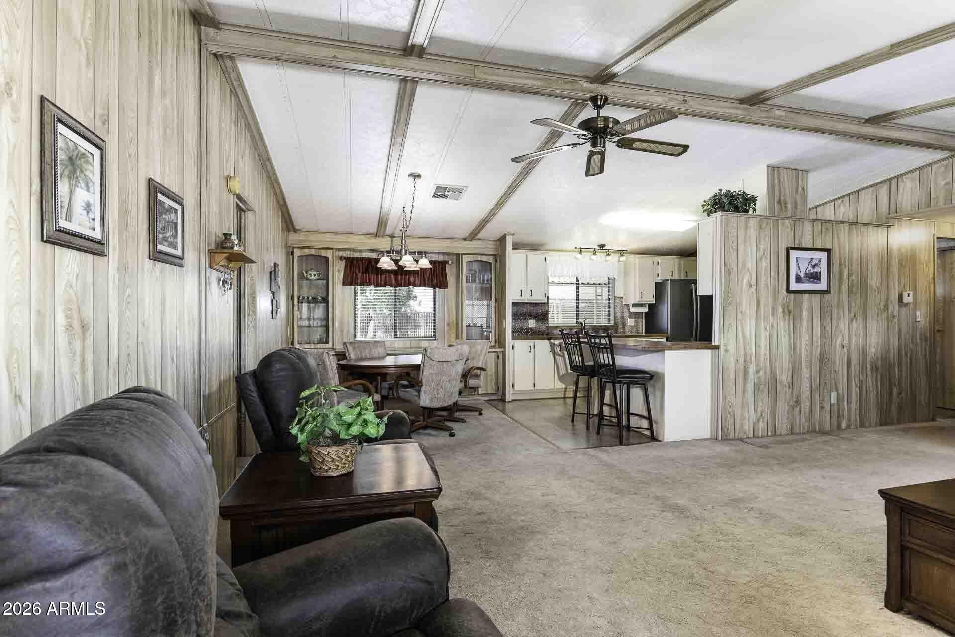 2100 North Trekell Road, Unit 143 Casa Grande, AZ 85122 - Photo 23 of 34 a living room with furniture and a chandelier
