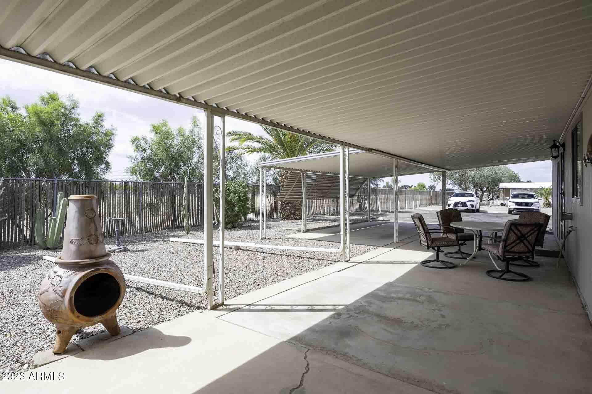 2100 North Trekell Road, Unit 143 Casa Grande, AZ 85122 - Photo 25 of 34 a view of a patio with a table and chairs