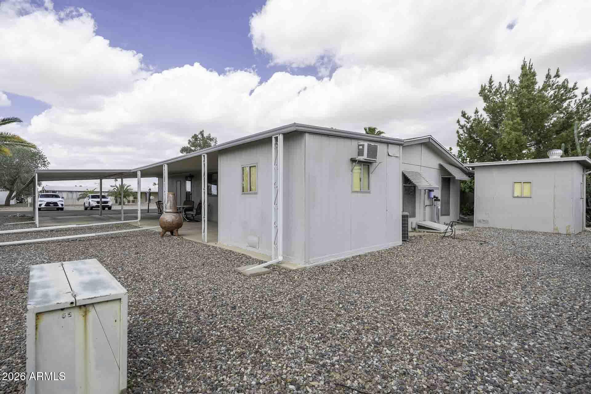 2100 North Trekell Road, Unit 143 Casa Grande, AZ 85122 - Photo 33 of 34 a view of a house with a backyard