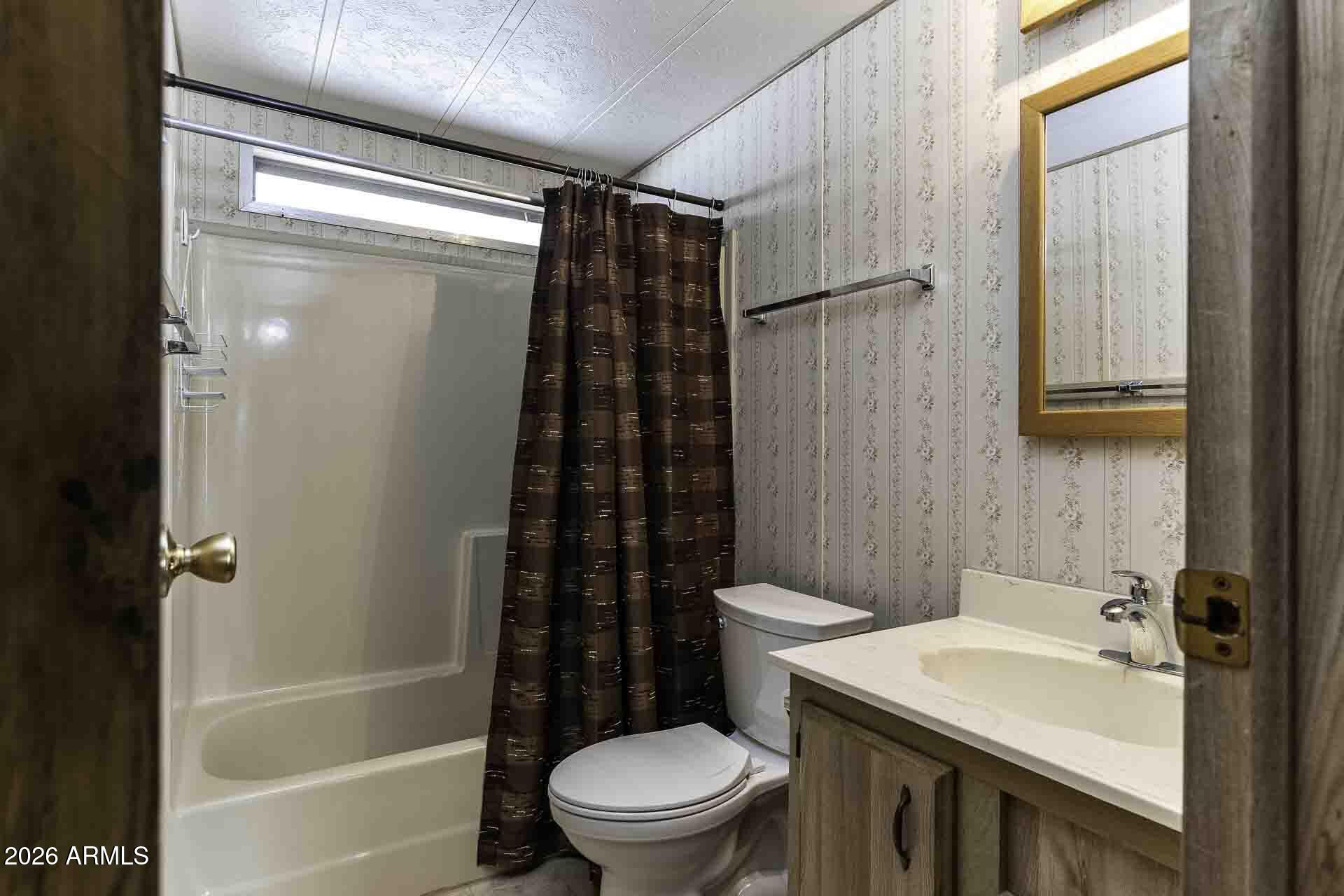 2100 North Trekell Road, Unit 143 Casa Grande, AZ 85122 - Photo 4 of 34 a bathroom with a sink toilet and shower