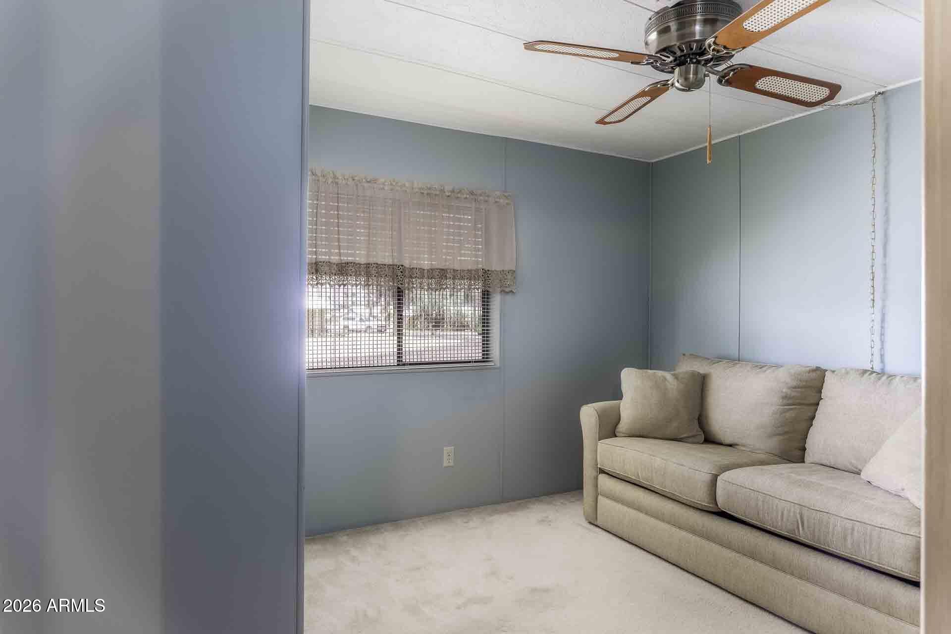 2100 North Trekell Road, Unit 143 Casa Grande, AZ 85122 - Photo 6 of 34 a living room with furniture and a window