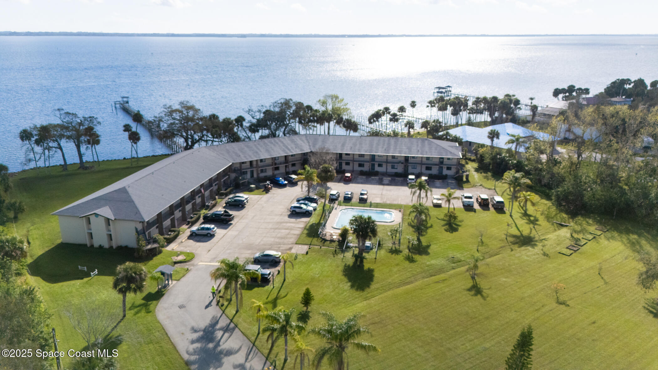 100 Canebreakers Drive, Unit 110 Cocoa, FL 32927 - Photo 1 of 34 an aerial view of a house with a swimming pool