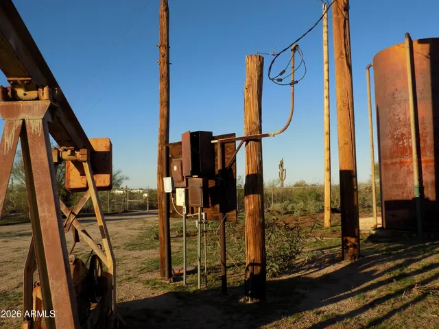 a street sign on a sidewalk next to a road