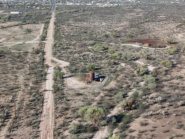 an aerial view of residential building and an ocean view