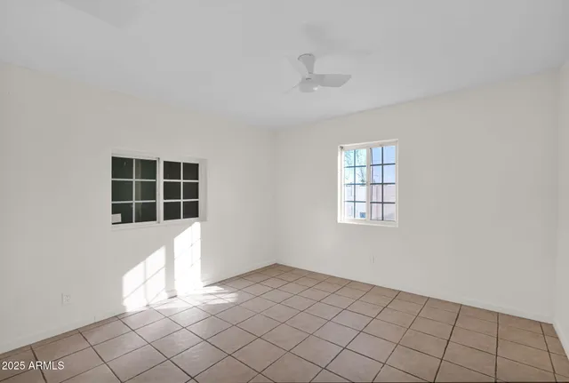 an empty room with windows
