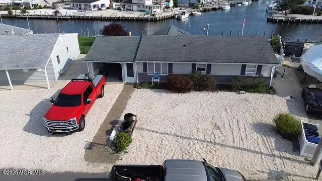 an aerial view of a house with wooden floor and city view
