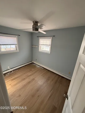 a bathroom with a shower and toilet