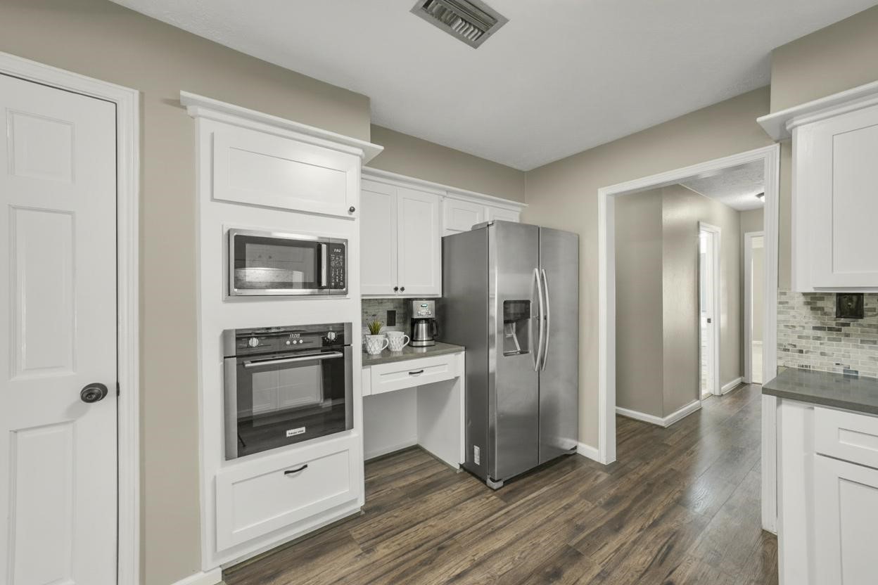 25302 Fairbrook Lane Spring, TX 77373 - Photo 13 of 49 a kitchen with stainless steel appliances a refrigerator stove and sink