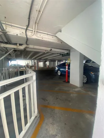 a balcony with table and chairs