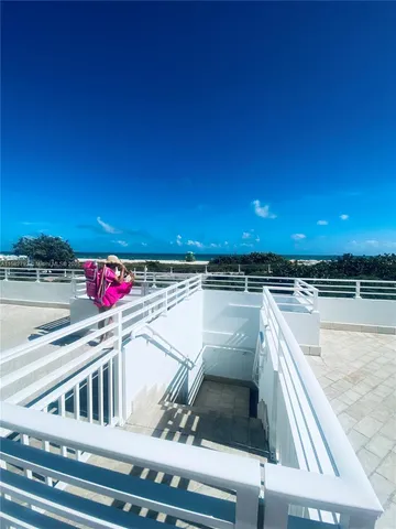 a view of balcony with a potted plant