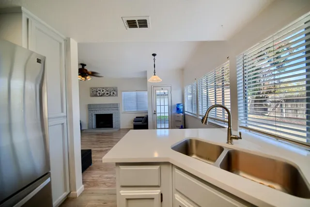 a kitchen with stainless steel appliances granite countertop a stove and a refrigerator