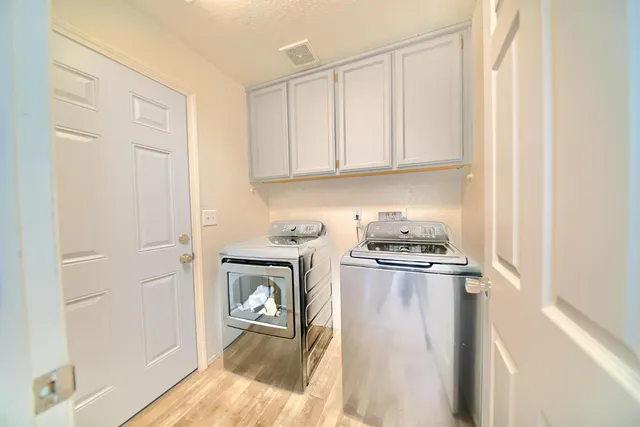 a bathroom with a sink and a large mirror