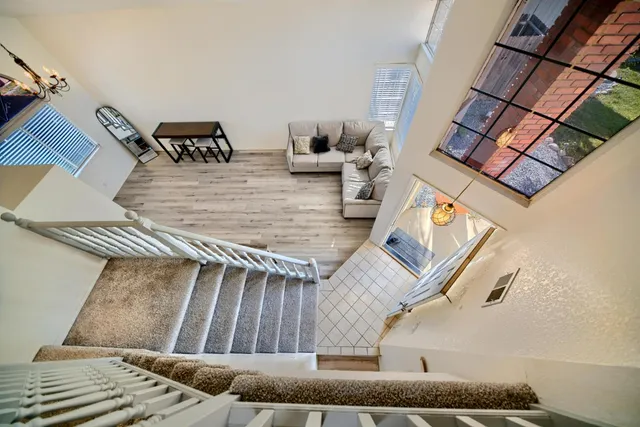 a view of a livingroom with furniture and closet