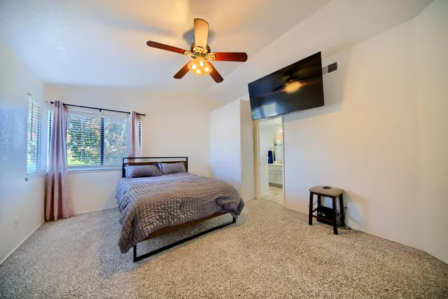 a room with a bed and a window in it