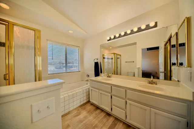 a view of a house with wooden deck and a backyard