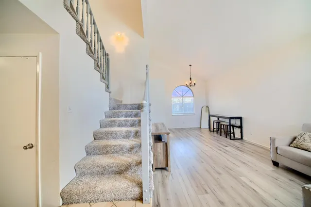 a large kitchen with stainless steel appliances granite countertop a stove and a sink