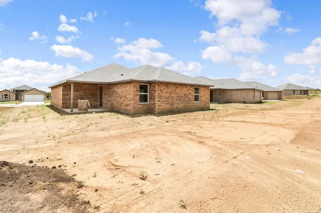 a view of large house with a yard