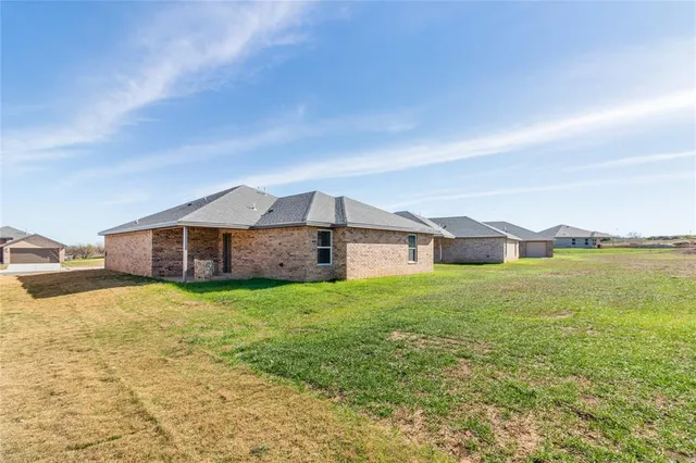 a house with yard in front of it