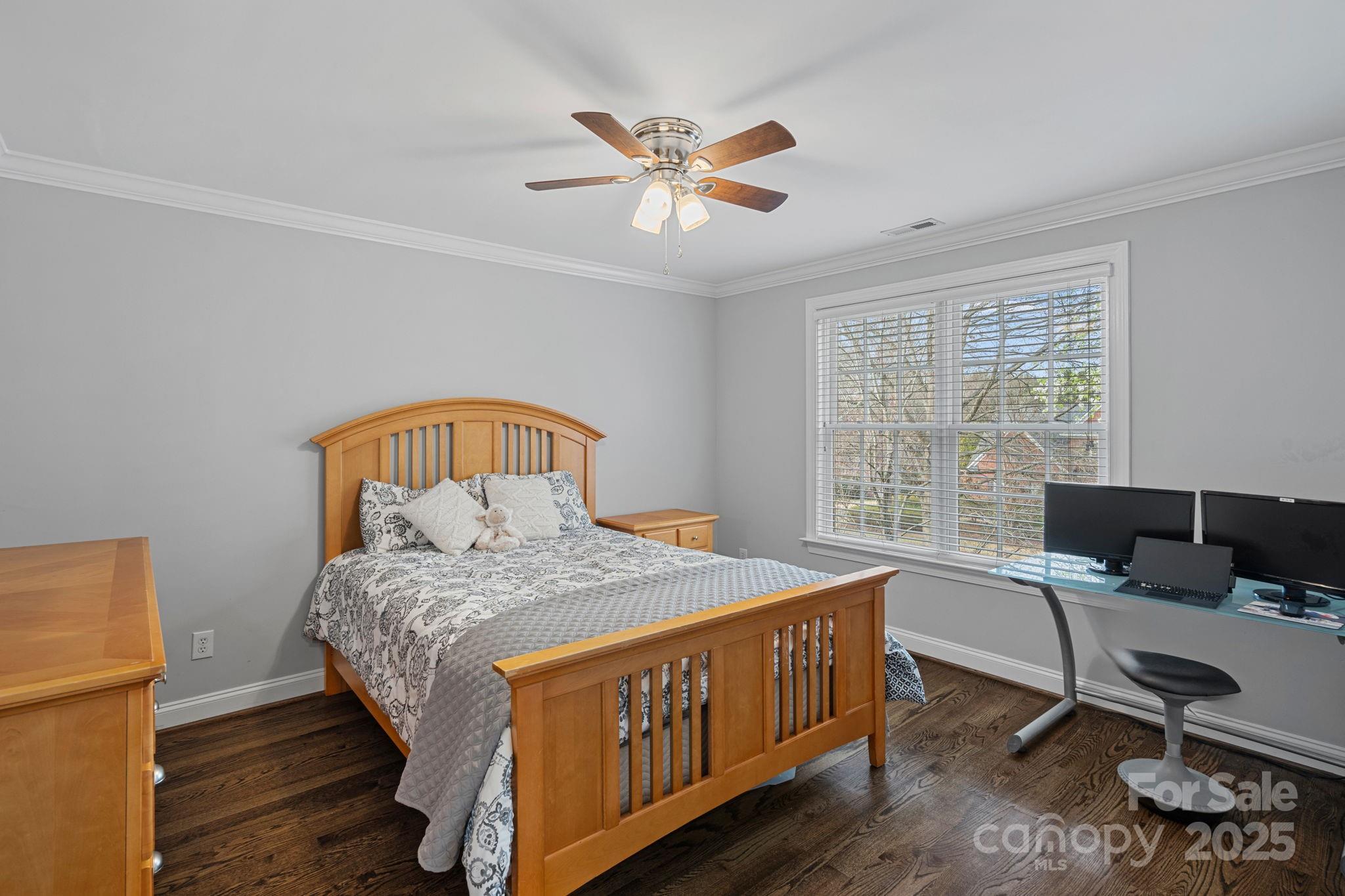 18334 Dembridge Drive Davidson, NC 28036 - Photo 22 of 35 a bedroom with a bed window and a desk