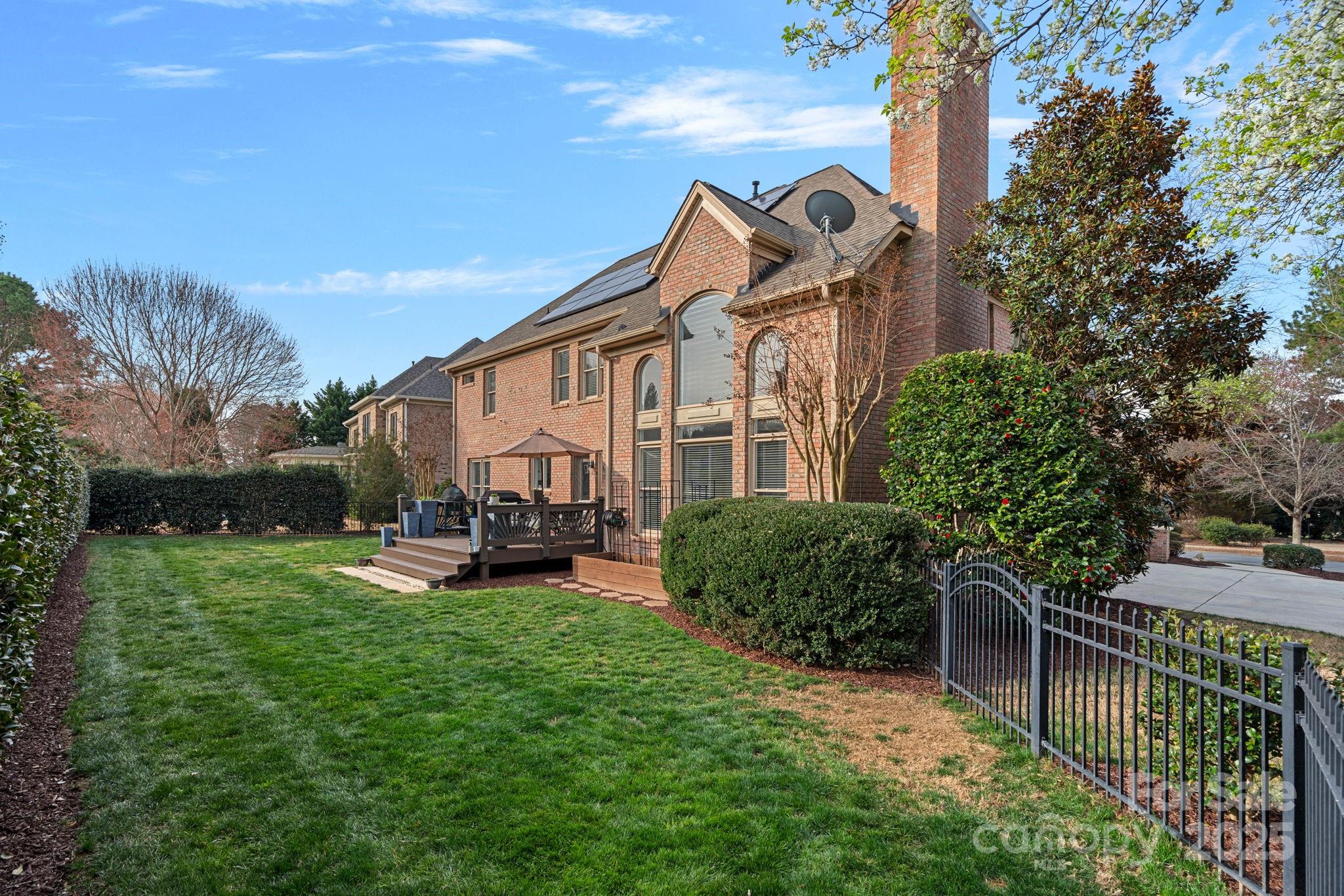 18334 Dembridge Drive Davidson, NC 28036 - Photo 31 of 35 a view of a chair and table in backyard of the house